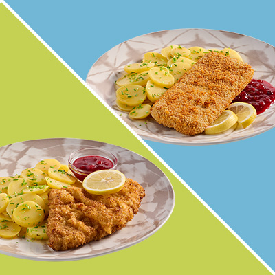 Ein vegetarisches Schnitzel und ein klassisches Schnitzel auf Tellern