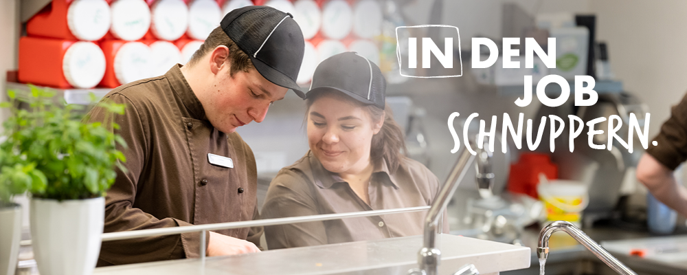 Sujet mit zwei Gastronomie-Lehrlingen und der Aufschrift: "IN den Job schnuppern." 
