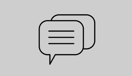 Ein Sprechblasen-Icon auf einem grauen Hintergrund