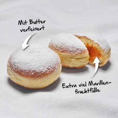 Bild vom Bäckerliebling Bäckerkrapfen mit der Aufschrift: "Mit Butter verfeinert" und "Extra viel Marillenfruchtfülle""