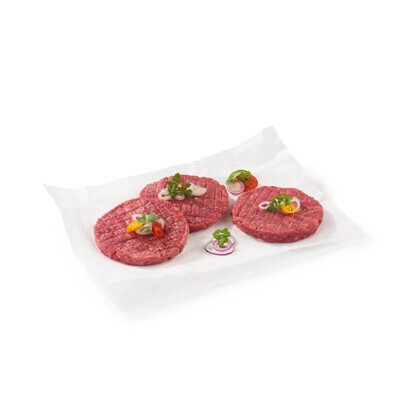 Drei Burgerpatties auf einem weißen Teller